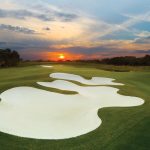 Panoramic view of a lush green golf course at Founders Golf Club. Smooth