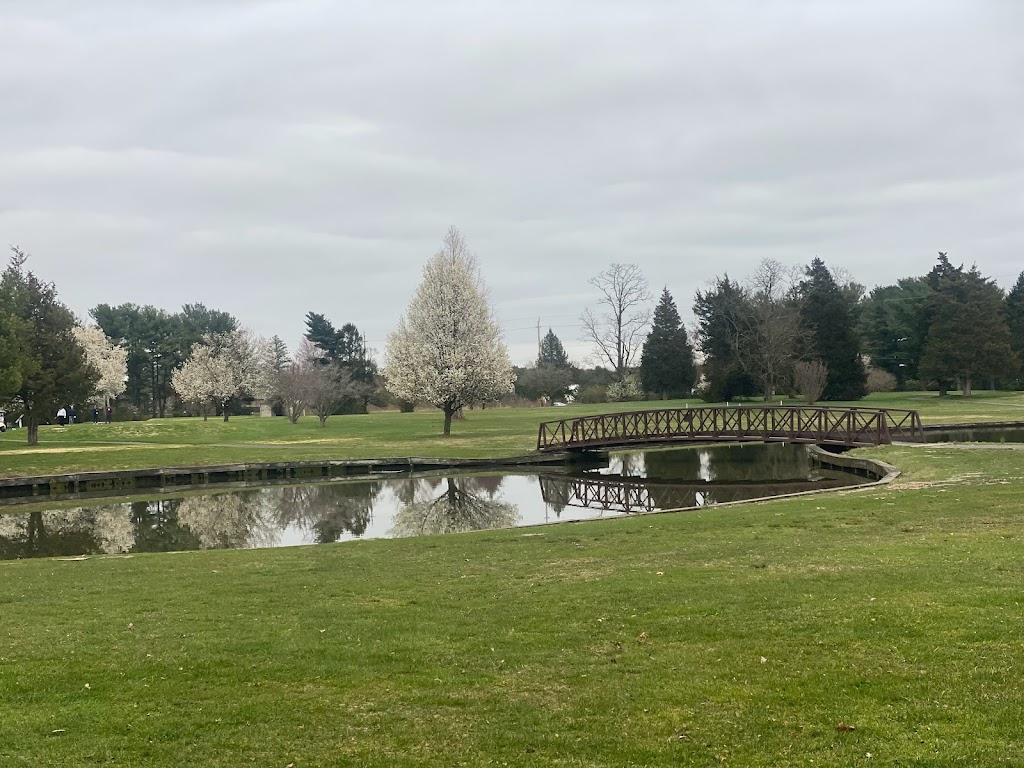 Panoramic view of a lush green golf course at Fountain Green Golf Course. Smooth