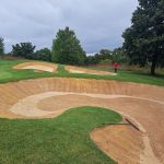 Panoramic view of a lush green golf course at Four Streams