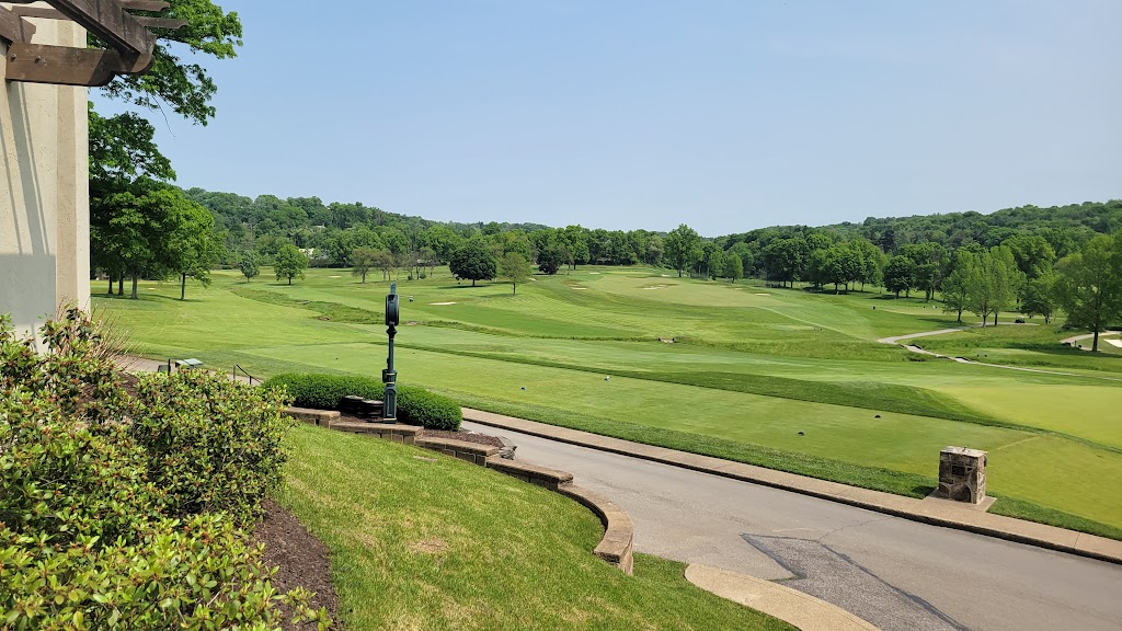 Panoramic view of a lush green golf course at Fox Chapel Golf Club. Smooth