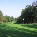 Panoramic view of a lush green golf course at Fox Hollow Golf Course. Smooth