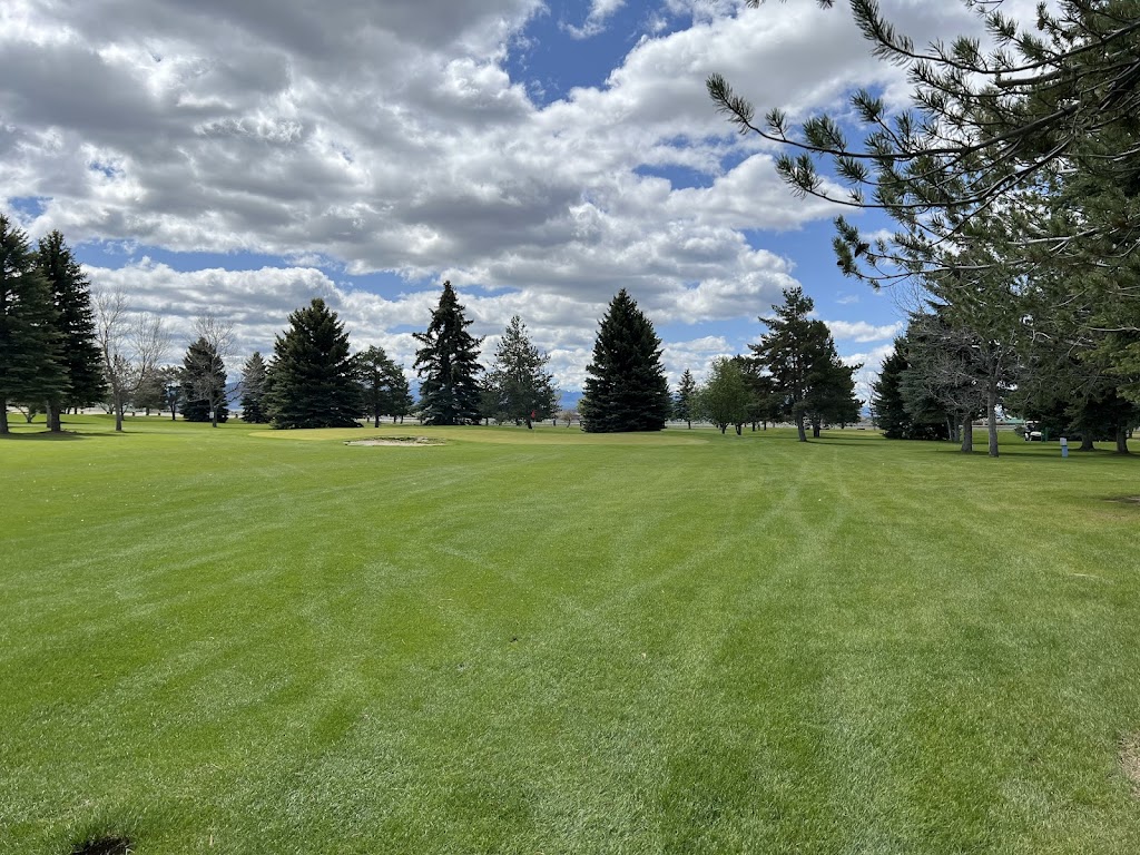 Panoramic view of a lush green golf course at Fox Ridge Golf Course. Smooth