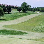 Panoramic view of a lush green golf course at Front Royal Golf Club. Smooth