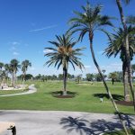 Panoramic view of a lush green golf course at Gasparilla Golf Club. Smooth