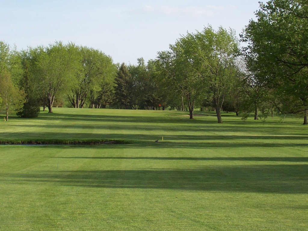 Panoramic view of a lush green golf course at Gates Park Golf Course. Smooth