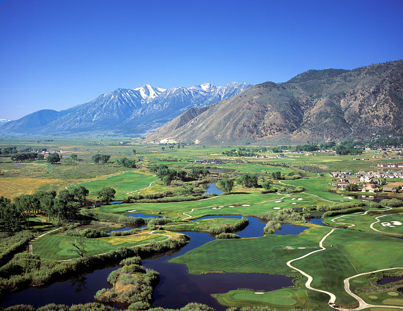 Panoramic view of a lush green golf course at Genoa Lakes Golf Club - Lakes Course and Ranch Course. Smooth