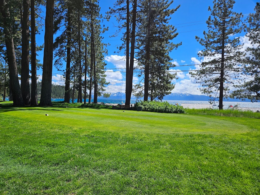 Panoramic view of a lush green golf course at Glenbrook Club. Smooth