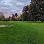 Panoramic view of a lush green golf course at Glendoveer Golf & Tennis. Smooth