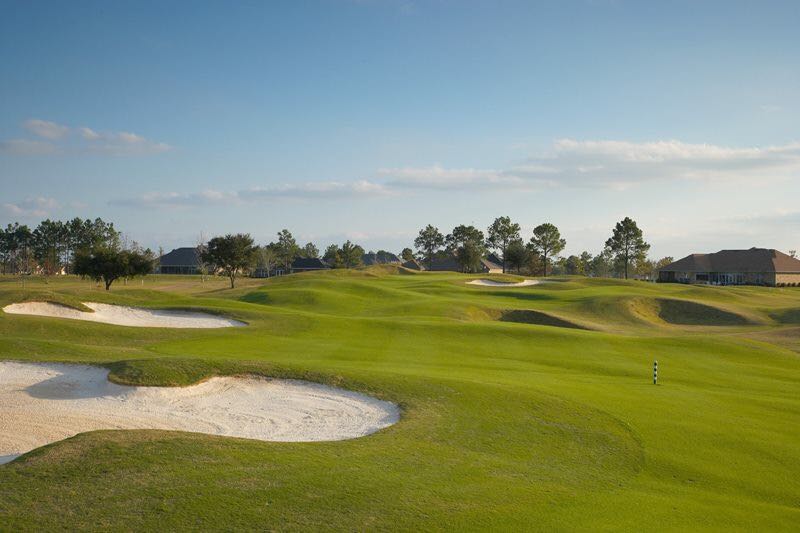 Panoramic view of a lush green golf course at Glenlakes Golf Club. Smooth