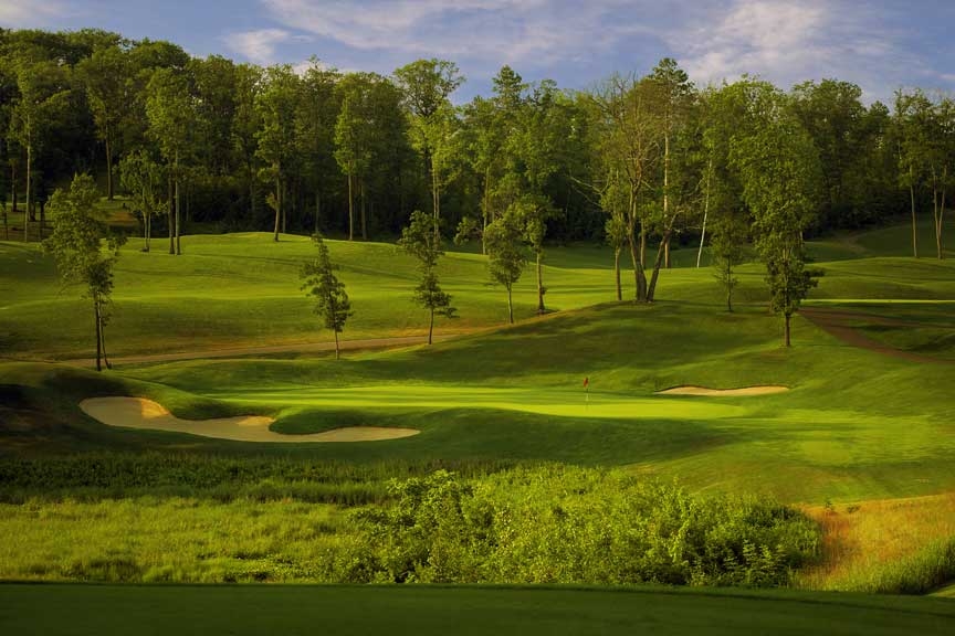 Panoramic view of a lush green golf course at Golden Eagle Golf Club. Smooth