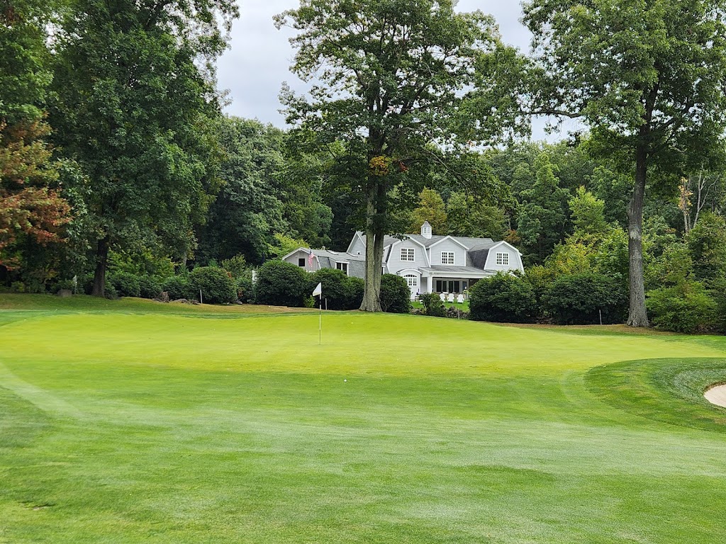 Panoramic view of a lush green golf course at Golf Club of Avon. Smooth