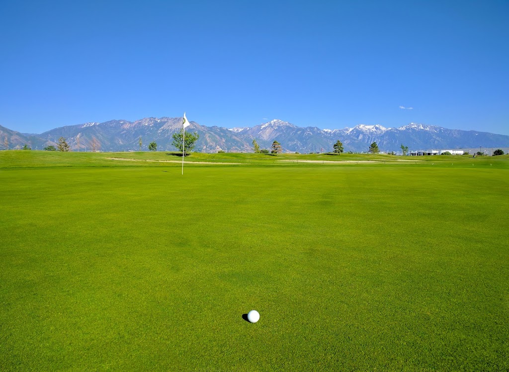 Panoramic view of a lush green golf course at Golf the Round. Smooth