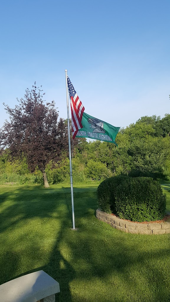 Panoramic view of a lush green golf course at Goose River Golf Course. Smooth