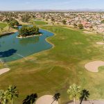 Panoramic view of a lush green golf course at Grandview Golf Course. Smooth