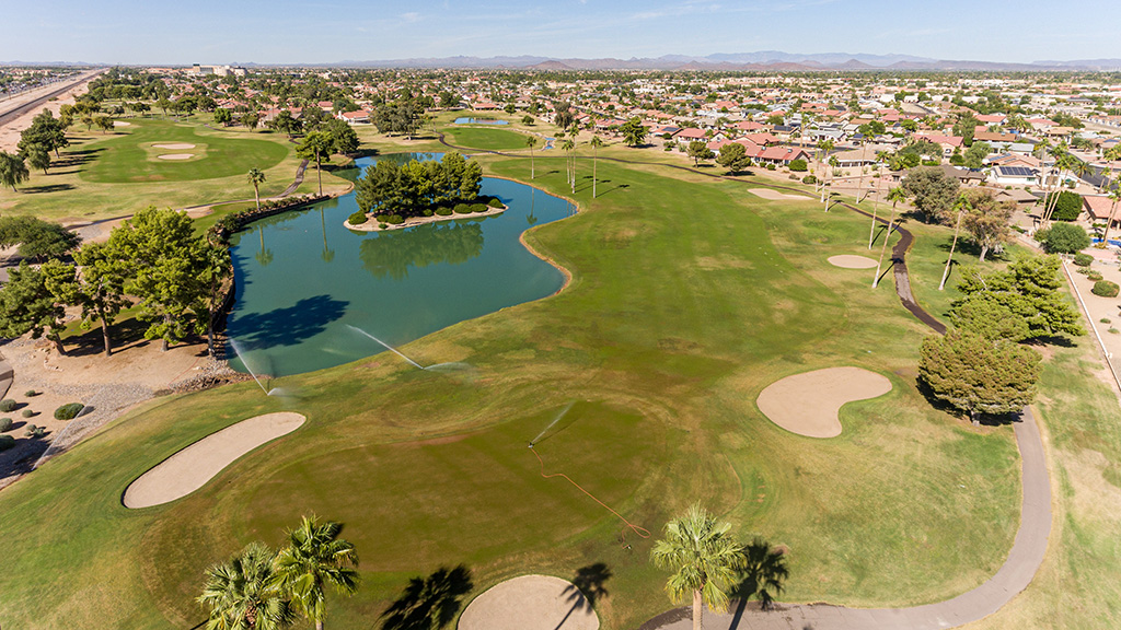 Panoramic view of a lush green golf course at Grandview Golf Course. Smooth