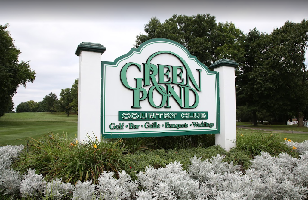 Panoramic view of a lush green golf course at Green Pond Country Club. Smooth