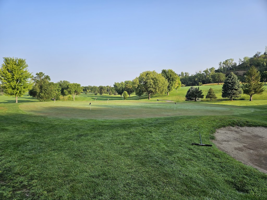 Panoramic view of a lush green golf course at Green Valley Golf Course. Smooth