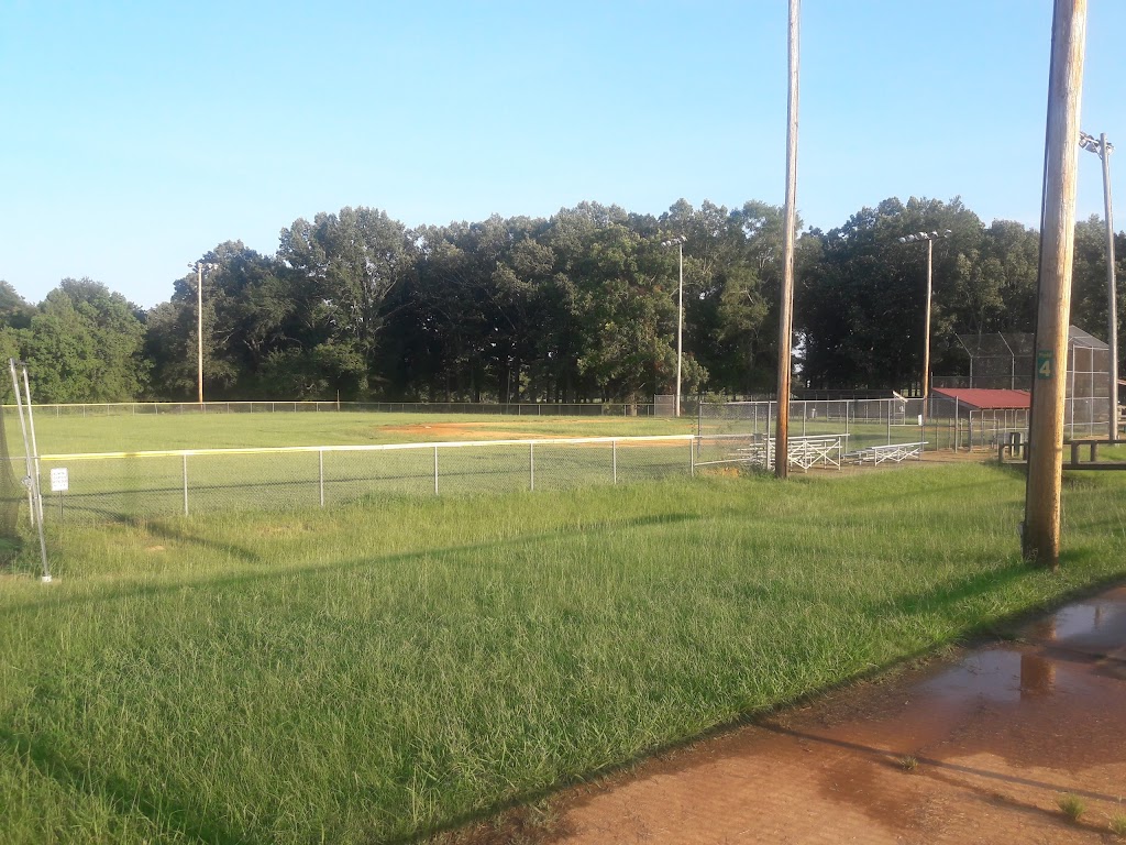 Panoramic view of a lush green golf course at Grove Park Golf Course. Smooth