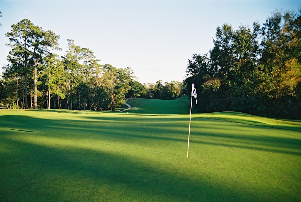 Panoramic view of a lush green golf course at Gulf Hills Golf Club. Smooth