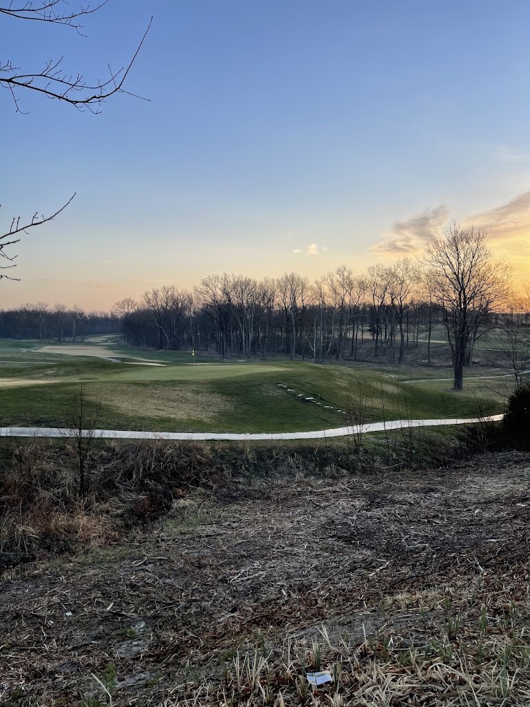 Panoramic view of a lush green golf course at Hail Ridge Golf Club. Smooth