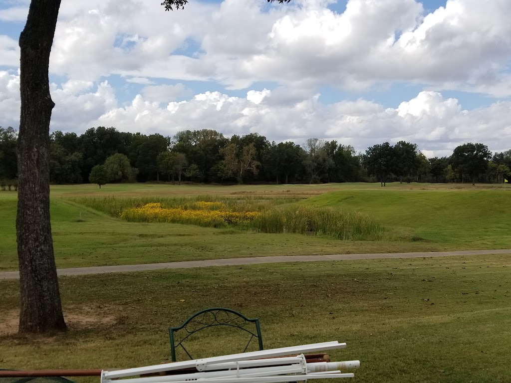 Panoramic view of a lush green golf course at Harbor Oaks Golf Club. Smooth