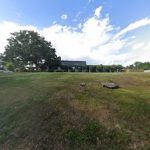 green grass with the flag in the hole.