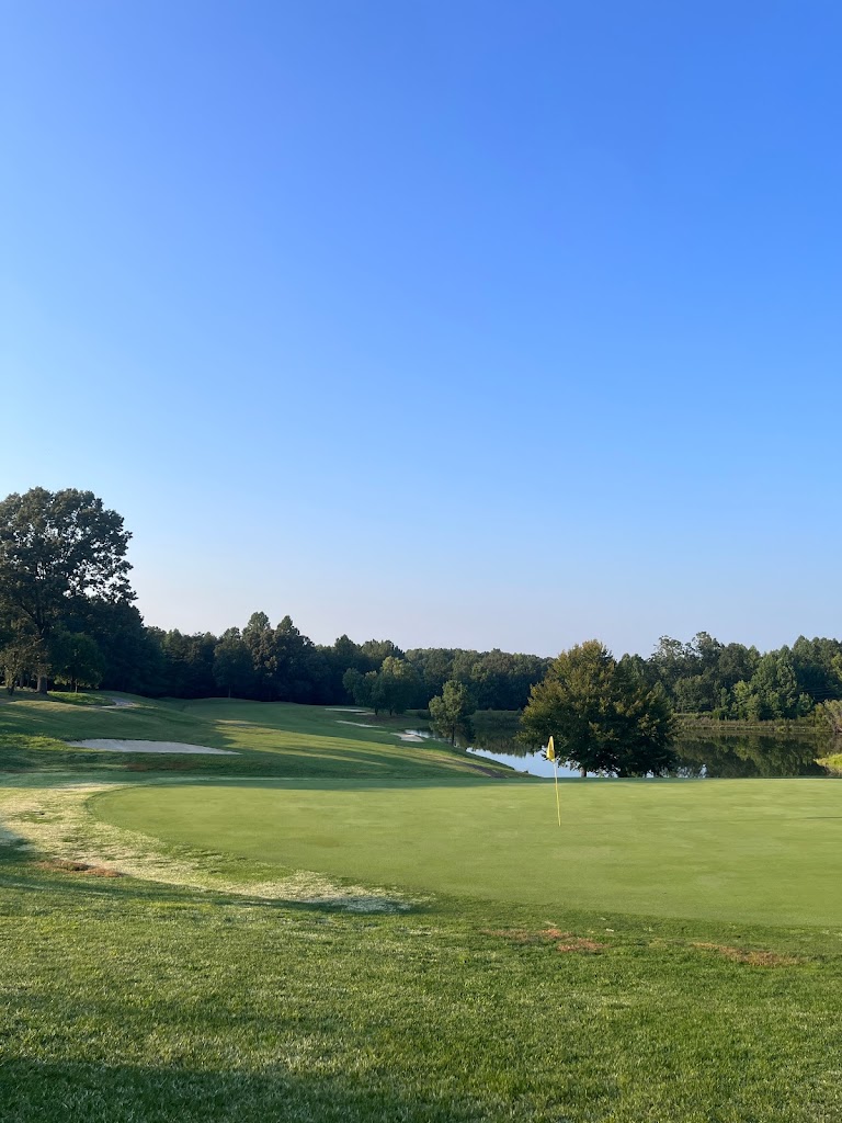 Panoramic view of a lush green golf course at Hat Creek Golf Course. Smooth