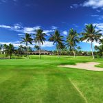 Panoramic view of a lush green golf course at Hawaii Prince Golf Club. Smooth