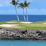 Panoramic view of a lush green golf course at Hawaii Tee Times. Smooth