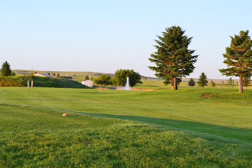 Panoramic view of a lush green golf course at Haycreek Golf Club. Smooth