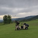 green grass with the flag in the hole.