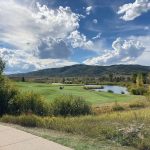 Panoramic view of a lush green golf course at Haymaker Golf Course. Smooth