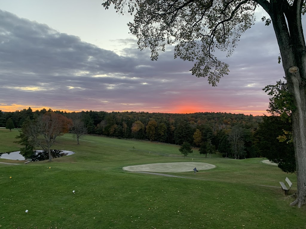 Panoramic view of a lush green golf course at Hemlock Ridge Golf Course. Smooth