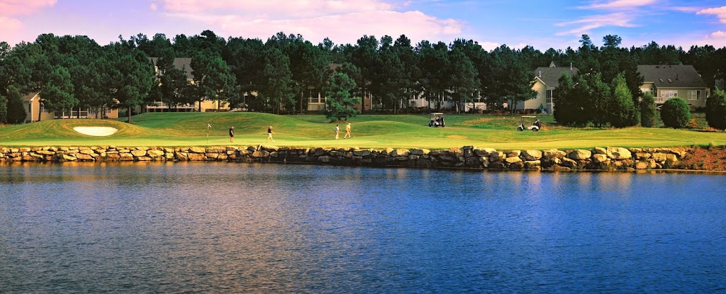 Panoramic view of a lush green golf course at Heritage Golf Course. Smooth