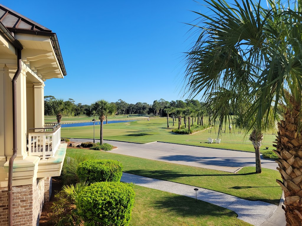 Panoramic view of a lush green golf course at Heron Point by Pete Dye. Smooth