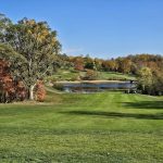 Panoramic view of a lush green golf course at Hickory Sticks Golf Club. Smooth