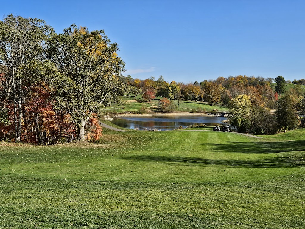 Panoramic view of a lush green golf course at Hickory Sticks Golf Club. Smooth