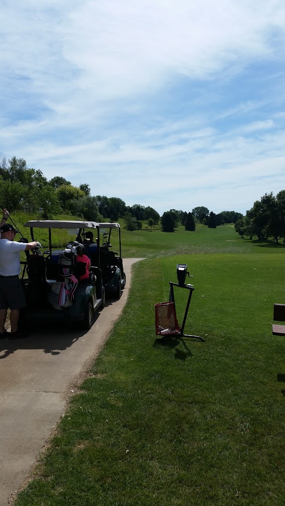 Panoramic view of a lush green golf course at Hidden Acres Golf Course. Smooth