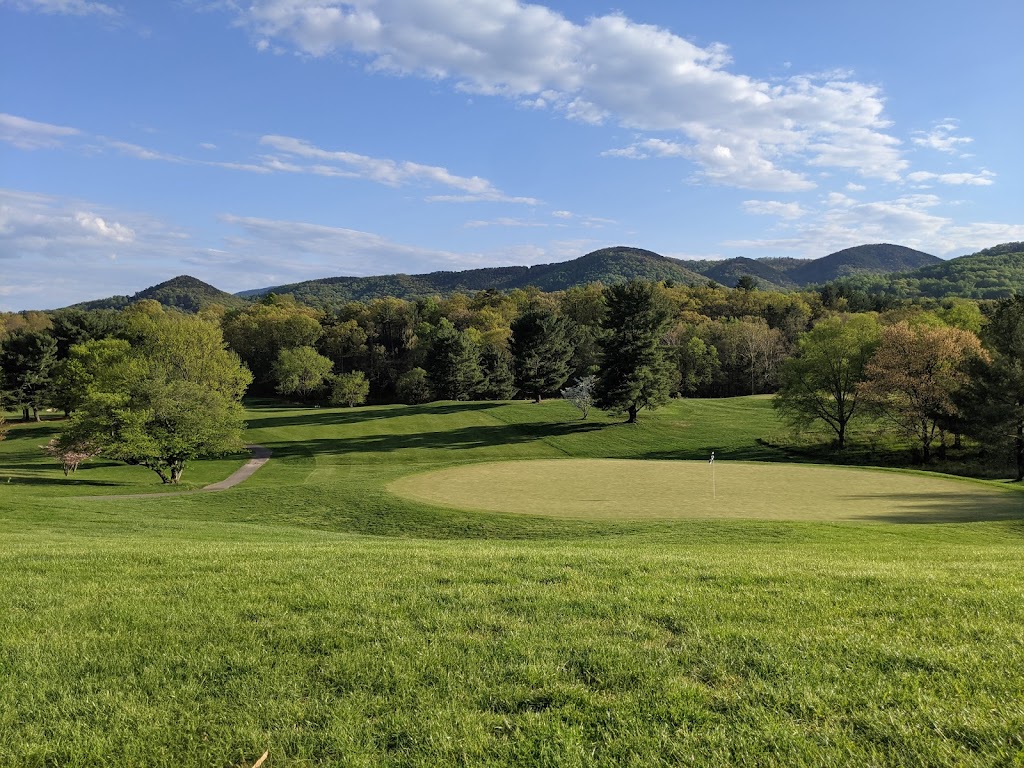 Panoramic view of a lush green golf course at Hidden Valley Country Club. Smooth