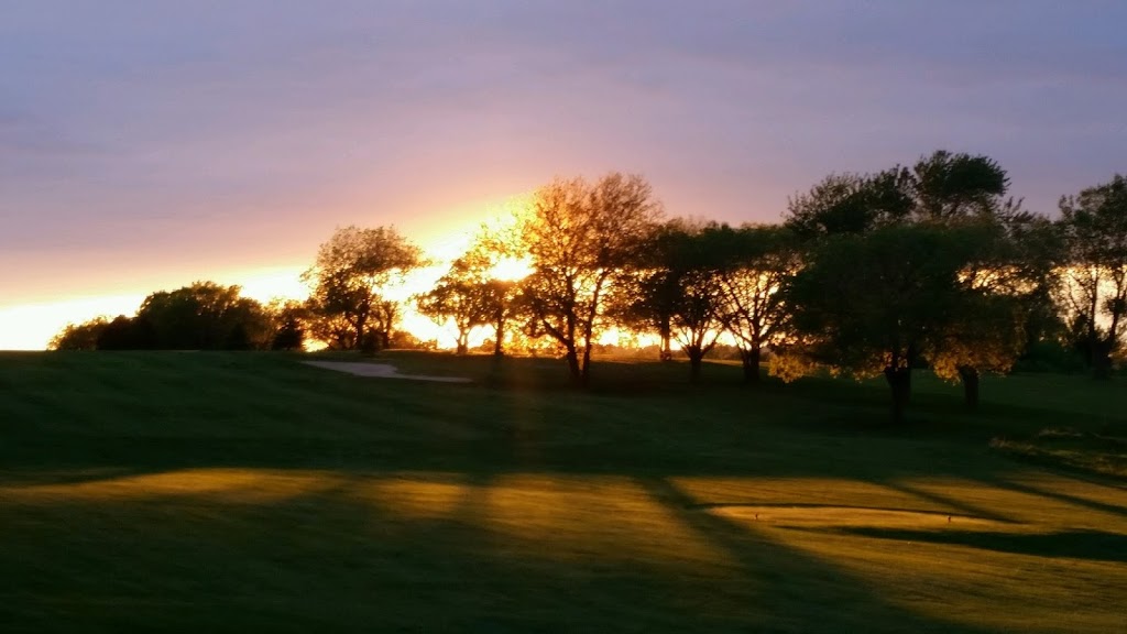 Panoramic view of a lush green golf course at Hidden Valley Golf Course. Smooth