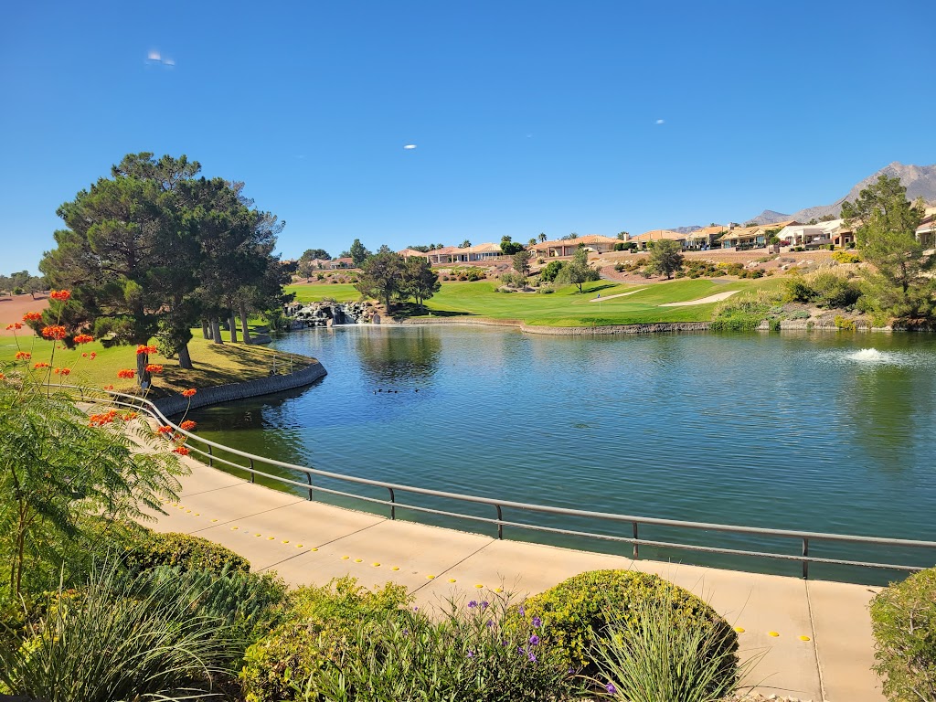 Panoramic view of a lush green golf course at Highland Falls Golf Club. Smooth