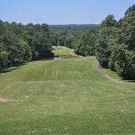 Panoramic view of a lush green golf course at Highland Walk Golf Course at Victoria Bryant. Smooth