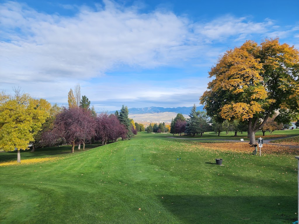 Panoramic view of a lush green golf course at Highlands Golf Club. Smooth