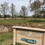 Panoramic view of a lush green golf course at Hillandale Golf Course. Smooth