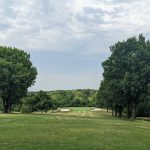 Panoramic view of a lush green golf course at Hillcrest Golf Course. Smooth