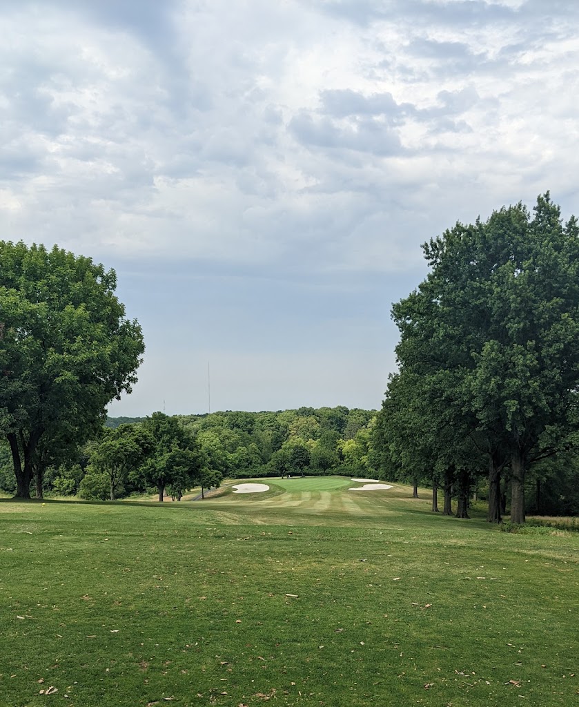 Panoramic view of a lush green golf course at Hillcrest Golf Course. Smooth