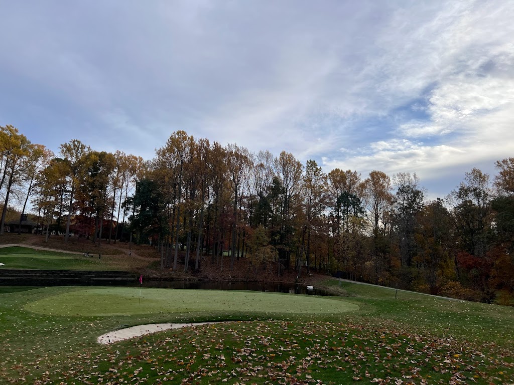 Panoramic view of a lush green golf course at Hobbit's Glen Golf Club. Smooth