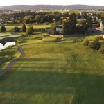 Panoramic view of a lush green golf course at Honeybrook Golf Club. Smooth