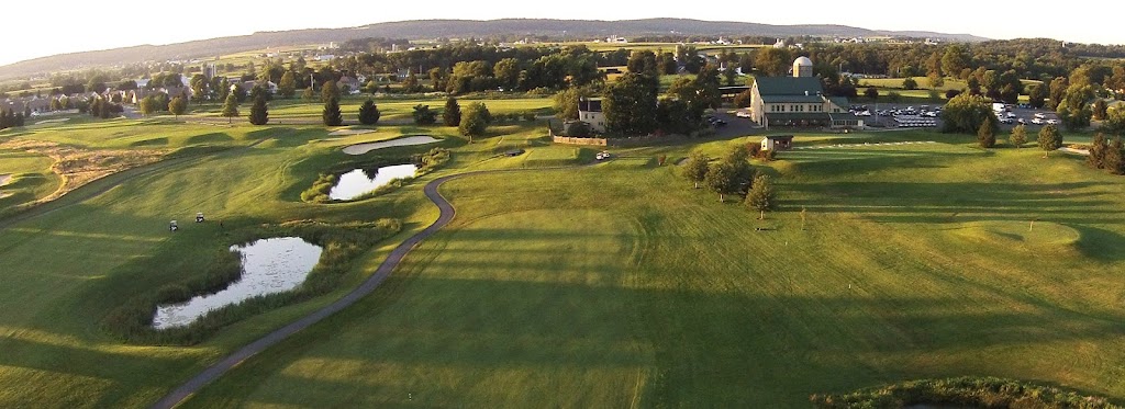 Panoramic view of a lush green golf course at Honeybrook Golf Club. Smooth