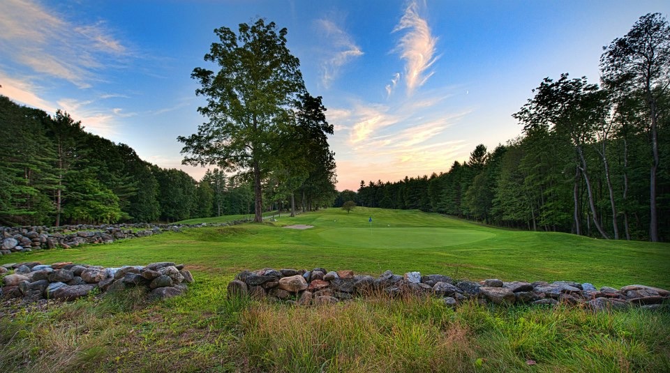 Panoramic view of a lush green golf course at Hooper Golf Course. Smooth